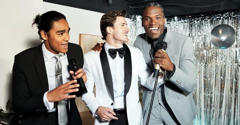 Several men in different mixed and matched black tie suits.